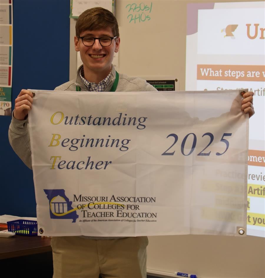  Charlie Yeldham with a banner.